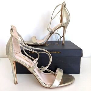 Lulu's metallic gold, lace-up or ankle tie sandals. 4" high heel.